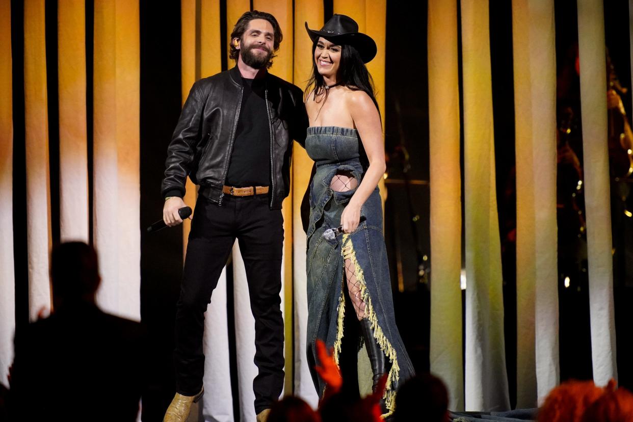 Thomas Rhett and Katy Perry perform during the 56th CMA Awards at Bridgestone Arena