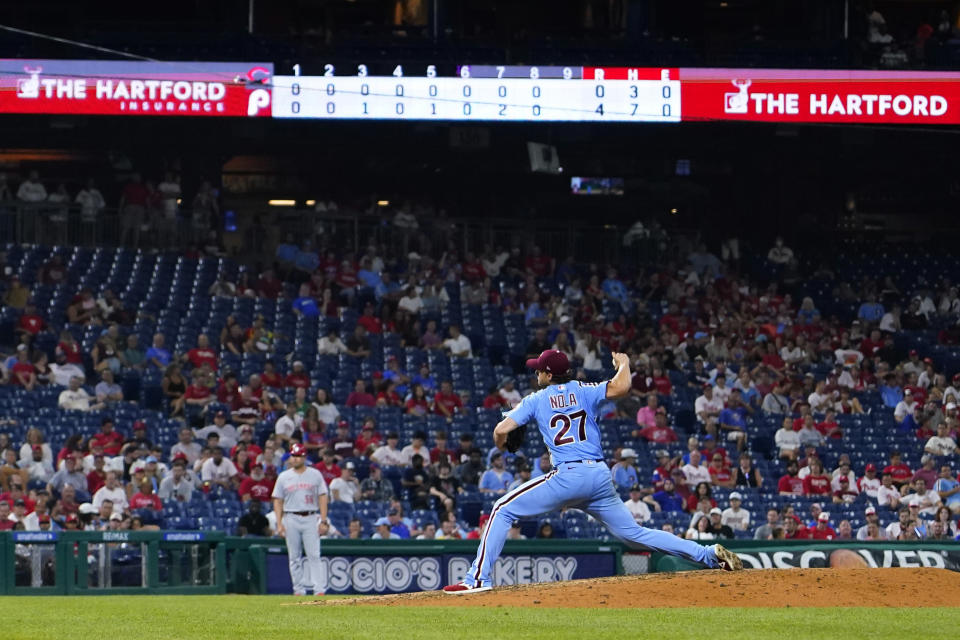 Philadelphia Phillies' Aaron Nola pitches during the ninth inning of a baseball game against the Cincinnati Reds, Thursday, Aug. 25, 2022, in Philadelphia. (AP Photo/Matt Slocum)