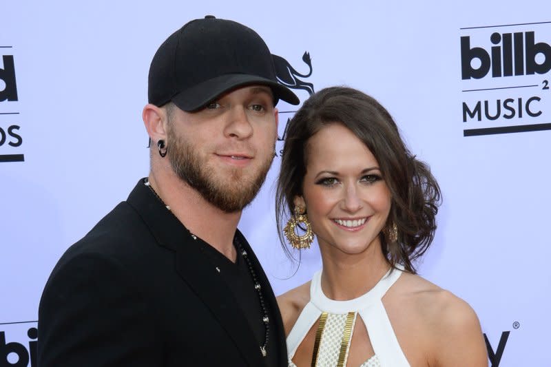 Brantley Gilbert (L) and Amber Cochran attend the Billboard Music Awards in 2015. File Photo by Jim Ruymen/UPI