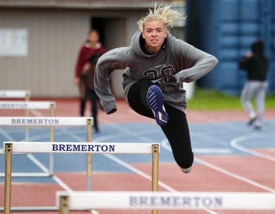 OC's Katelyn Barnes warms up on the hurdles during practice at Bremerton Memorial Stadium on Monday, May 9, 2022. 