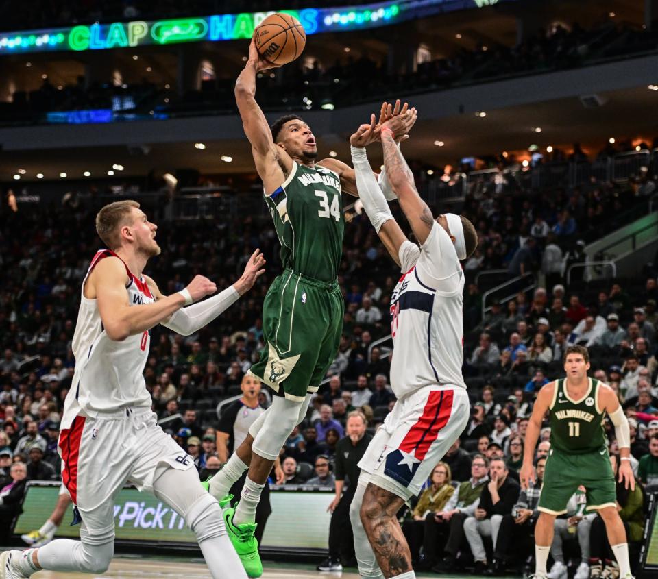 Bucks forward Giannis Antetokounmpo goes up for a potential posterizing dunk on Wizards center Daniel Gafford (right) in the fourth quarter Tuesday. Unfortunately for Giannis, he missed the dunk.