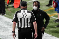 Atlanta Falcons interim head coach Raheem Morris speaks to an official during the second half of an NFL football game against the Las Vegas Raiders, Sunday, Nov. 29, 2020, in Atlanta. (AP Photo/Brynn Anderson)