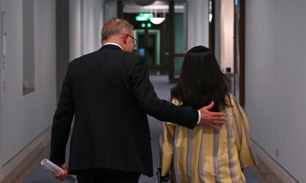 Anthony Albanese and Linda Burney seen from behind with Albanese with his hand on Burney’s back 