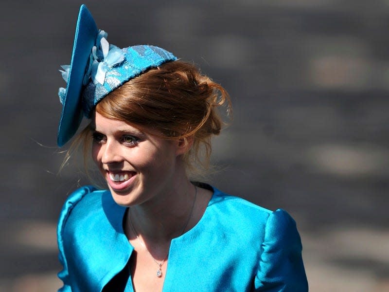 Princess Beatrice wears a turquoise jacket and fascinator.