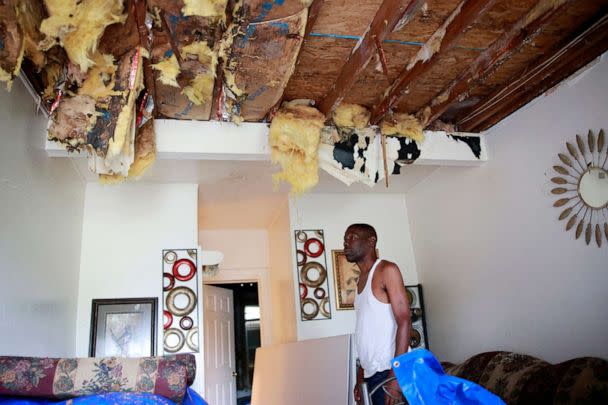 PHOTO: Wilbur Sandlin III looks at his roof that has not been fixed since July when a tree struck his rental home in Jacksonville, FLa., Sept. 28, 2022 (Corey Perrine/Florida Times-Union via USA Today Network)