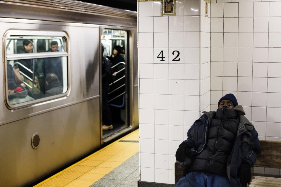 A man sleeps on a wooden bench in Grand Central Station in New York, February 1, 2013. Grand Central Terminal, the doyenne of American train stations, is celebrating its 100th birthday. Opened on Feb. 2, 1913 the iconic New York landmark with its Beaux-Arts facade is an architectural gem, and still one of America's greatest transportation hubs. (REUTERS/Lucas Jackson)