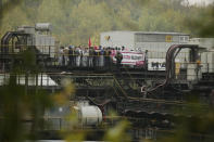 Activists block Garzweiler power plant site, a coal conveyor, in Grevenbroich, western Germany, Saturday, Sept. 26, 2020. Anti-coal protesters have entered a mine to protest the continued extraction and use of fossil fuels. (David Young/dpa via AP)