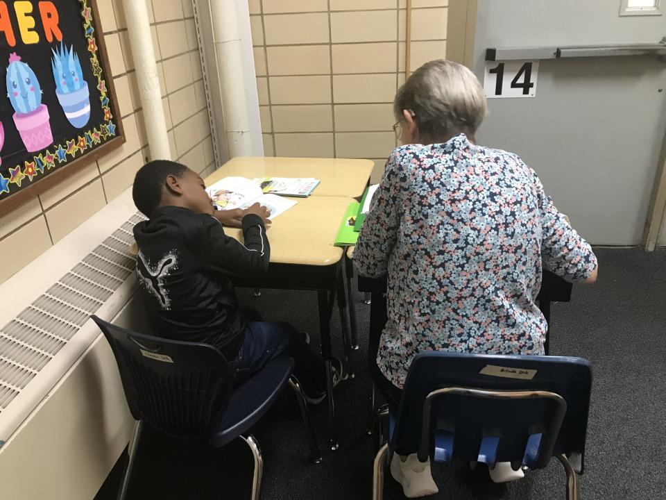 Marge Mangelsdorf, a 22-year Oasis veteran, working with first grader Harlan. (Kevin Mahnken)