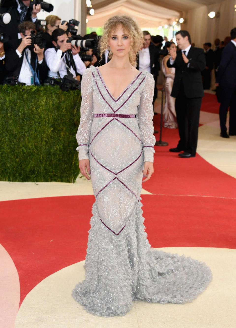 Juno Temple in a silver and purple gown 