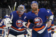 New York Islanders goaltender Semyon Varlamov (40) and right wing Leo Komarov (47) skate off the ice after losing 2-1 to the Tampa Bay Lightning in Game 3 of the NHL hockey Stanley Cup semifinals, Thursday, June 17, 2021, in Uniondale, N.Y. (AP Photo/Frank Franklin II)