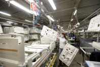 A worker assembles a hospital bed at the Linet factory in Slany, Czech Republic, Monday, Oct. 19, 2020. A Czech hospital bed maker with a full order book received one more order that was impossible to turn down. The company was approached by Prime Minister Andrej Babis to deliver beds for a military field hospital for 500 COVID-19 patients, to be built this week in Prague. (AP Photo/Petr David Josek)