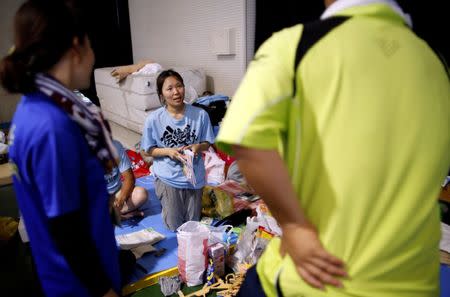 Evacuee 39-year-old Eri takes a break at Okada elementary school acting as an evacuation centre in Mabi town in Kurashiki, Okayama Prefecture, Japan, July 12, 2018. REUTERS/Issei Kato