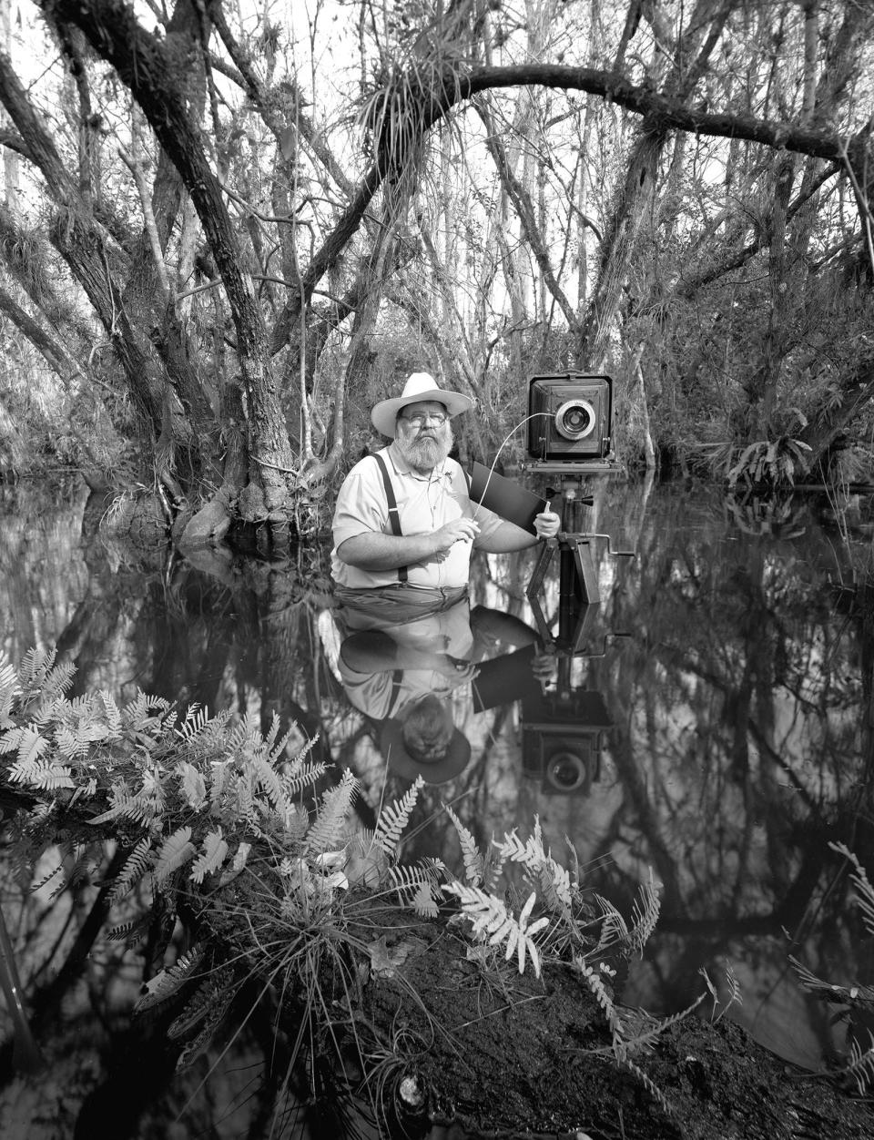 A 1993 photo of photographer Clyde Butcher preparing to take pictures.