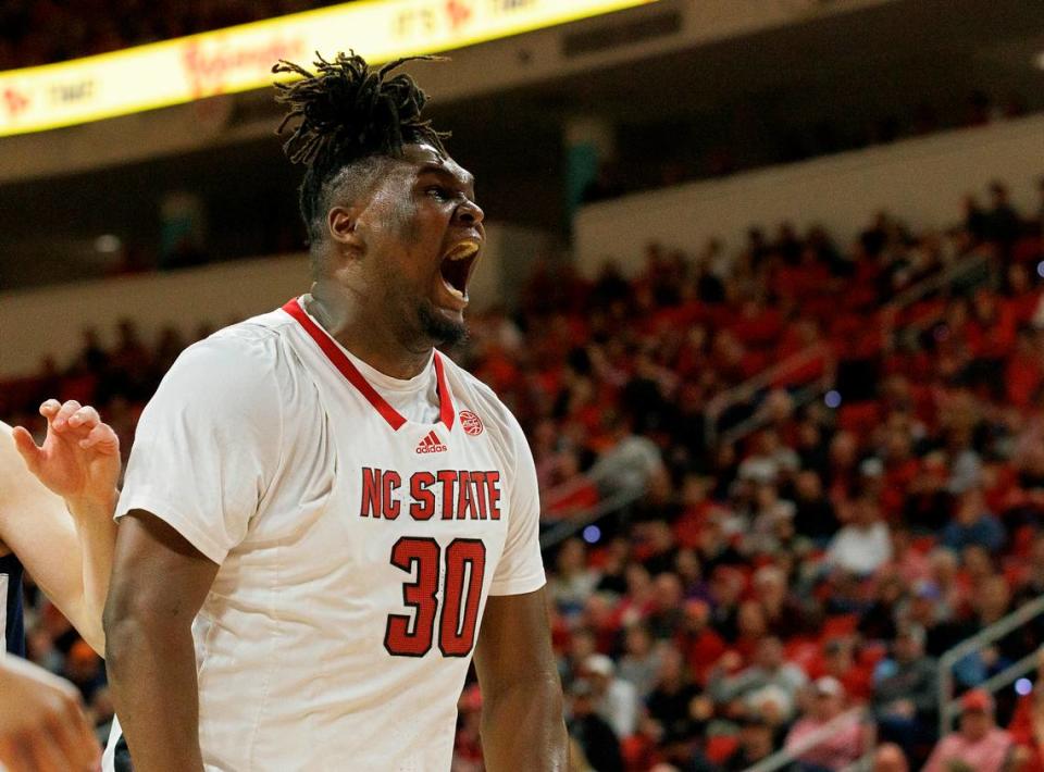 N.C. State’s DJ Burns Jr. reacts after making a basket and being fouled during the first half of the Wolfpack’s game against Virginia on Saturday, Jan. 6, 2024, at PNC Arena in Raleigh, N.C.