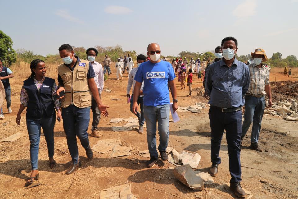 Plan International Australia Deputy CEO Mudasser Siddiqui at a refugee camp in Ethiopia. He wears a mask.