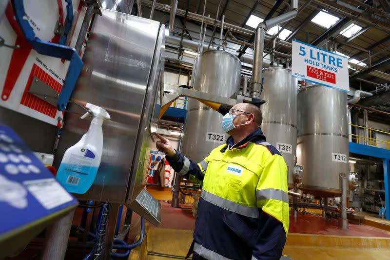 Ecolab employees on the filling line prepare the Skinman Soft Protect FF virucidal hand rub that is supplied to the NHS