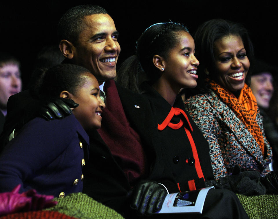 U.S. President Barack Obama (C) and daughters Sasha (2nd L), Malia (2nd R) and first lady Michelle Obama (R) participate in the 2011 National Christmas Tree Lighting on December 1, 2011 at the Ellipse, south of the White House, in Washington, DC. (Photo by Roger L. Wollenberg-Pool/Getty Images)