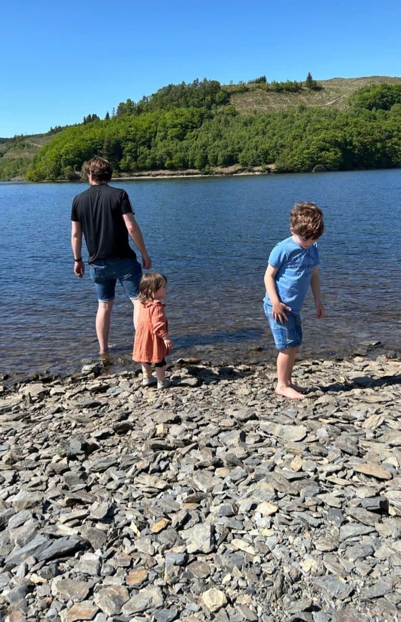 Alex's son, daughter and husband by the water