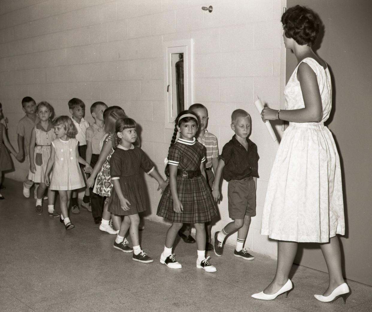 A teacher lines up her students on the first day of school at Mayport Elementary School, Sept. 1, 1964.