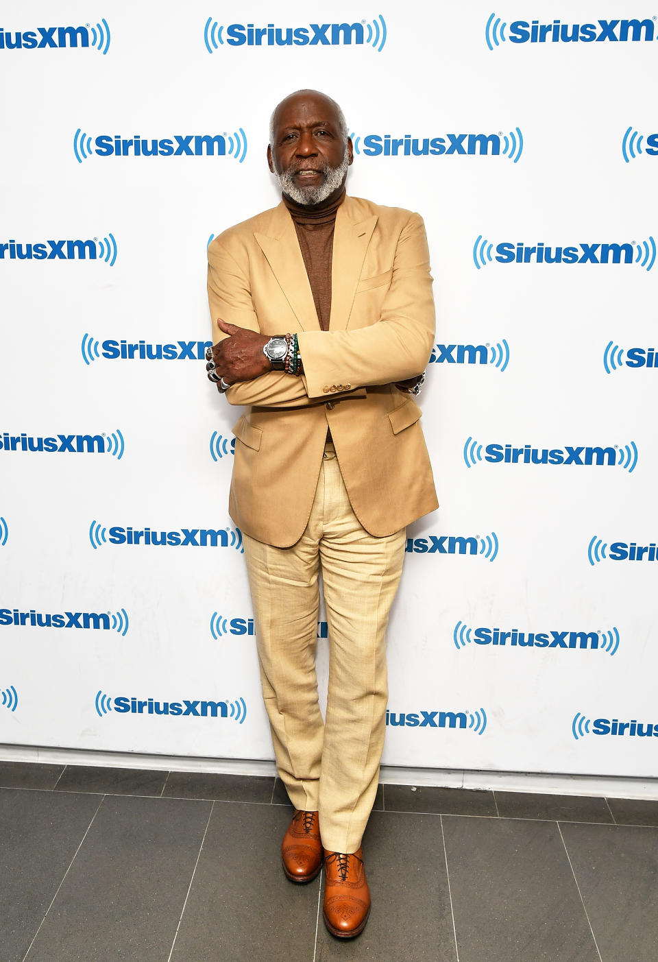 Richard Roundtree wears khaki suit and brown shoes