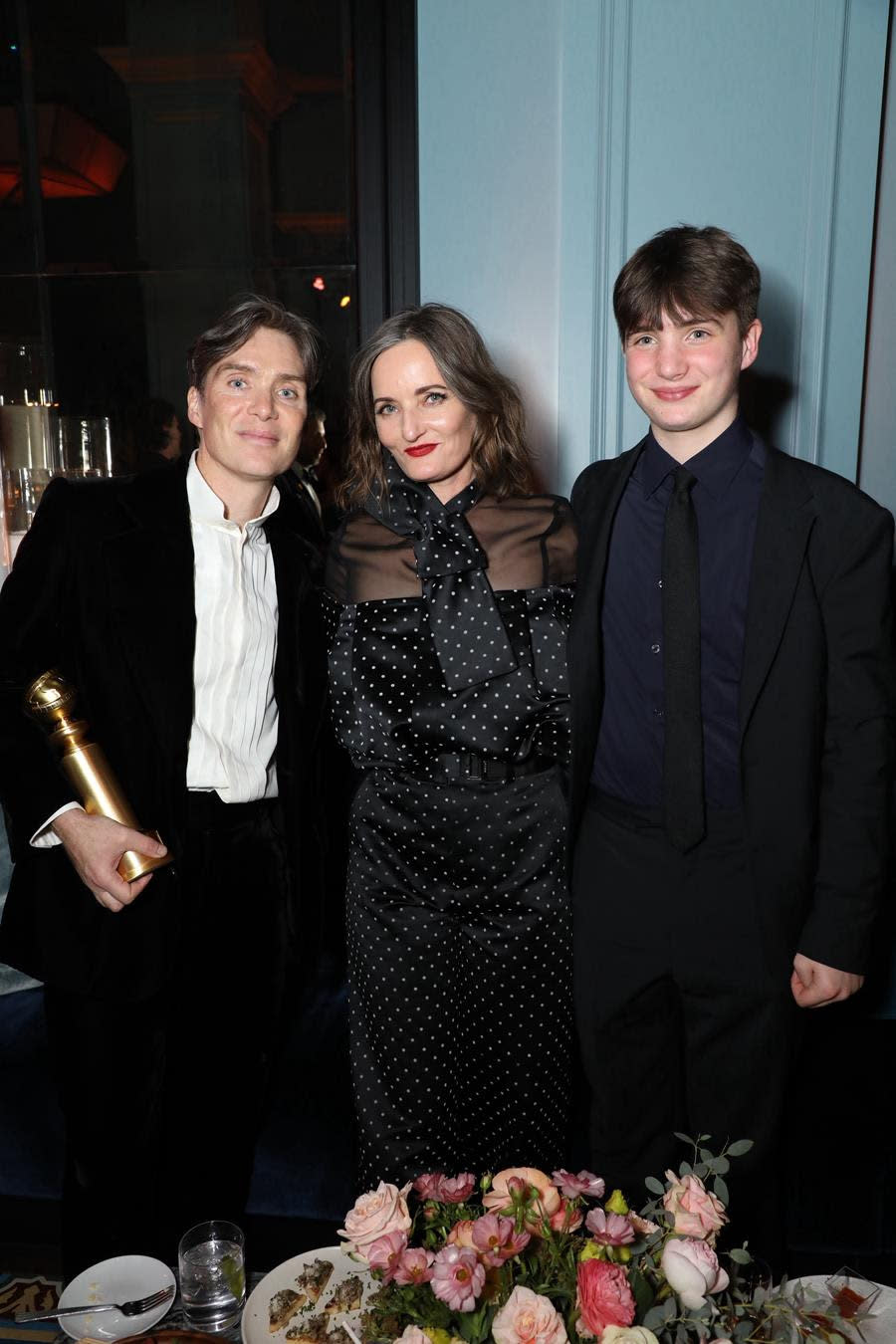 “Oppenheimer” star Cillian Murphy (Left) brought his wife, artist Yvonne McGuinness, and their son Aram to the Universal Pictures 2024 post-Golden Globes celebration, along with his Best Actor Drama trophy. (Alex Berliner ABImages)