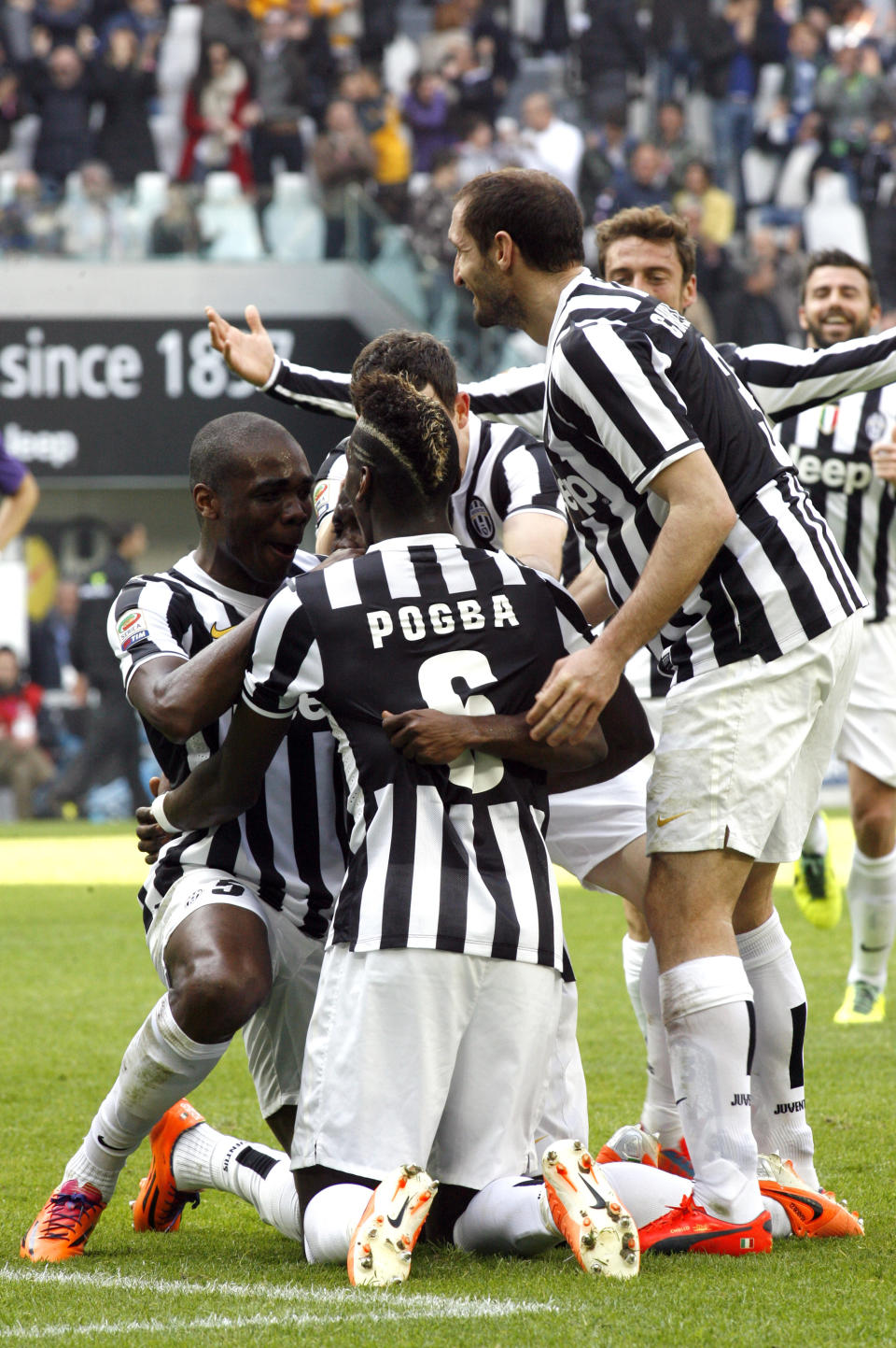 Juventus players celebrate after Kwadwo Asamoah scored during a Serie A soccer match between Juventus and Fiorentina at the Juventus stadium, in Turin, Italy, Sunday, March 9, 2014. (AP Photo/Massimo Pinca)