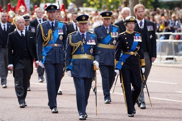 Members of the royal family, including the King, follow the Queen's coffin