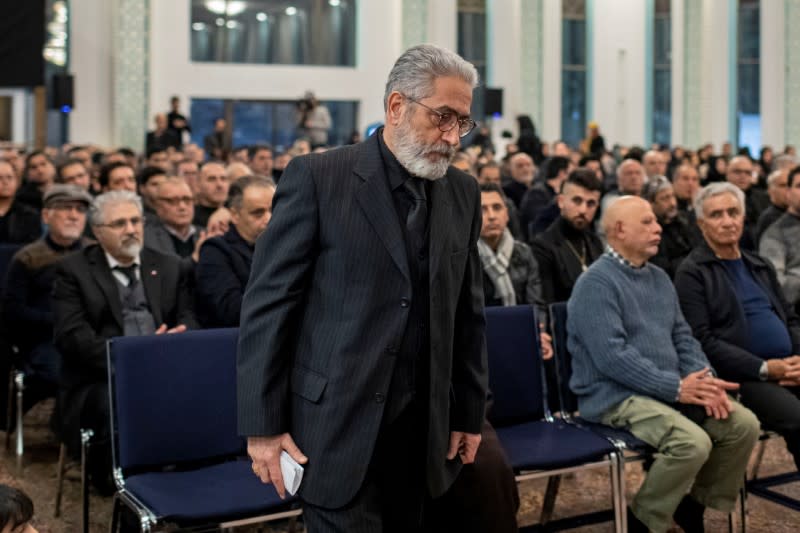 Mourners attend a memorial for the victims of a Ukrainian passenger jet which was shot down in Iran