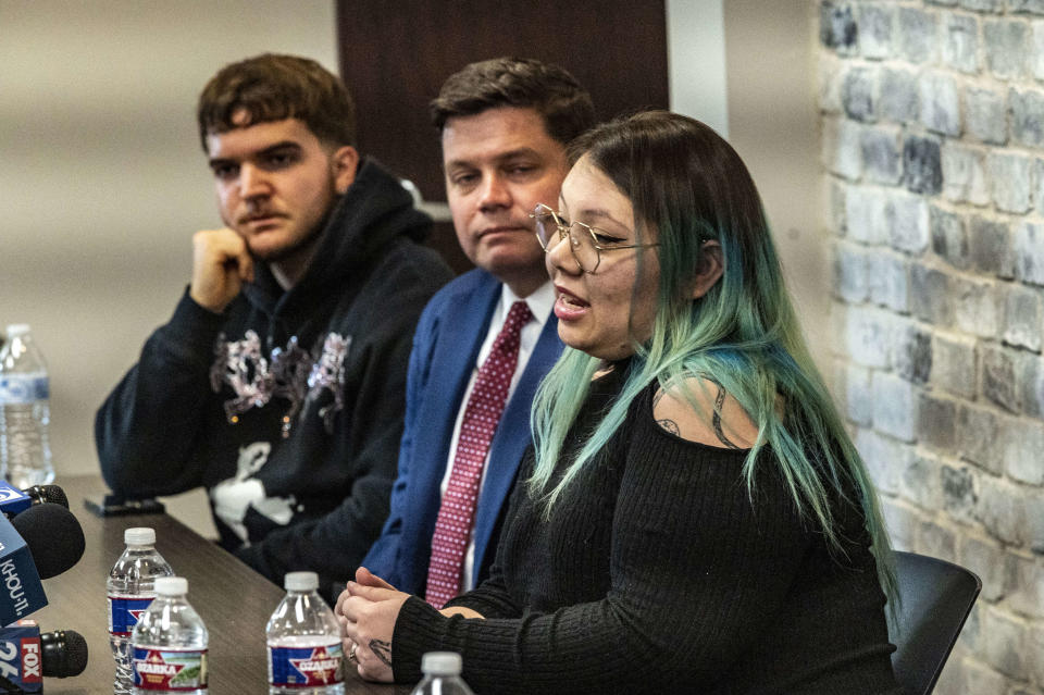 Niemma Mostacci, right, describes the days immediately before her father's death during a press conference, Wednesday, April 24, 2024 in The Woodland, Texas. Several relatives of patients who died while waiting for a new liver said Wednesday they want to know if their loved ones were wrongfully denied a transplant by Dr. Steve Bynon, a Houston doctor accused of manipulating the waitlist to make some patients ineligible to receive a new organ. (Kirk Sides/Houston Chronicle via AP)