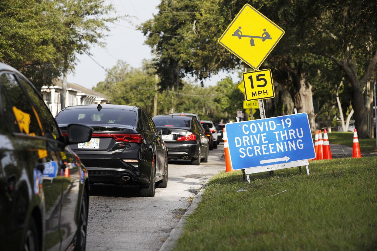 Drivers wait in line to be tested for the coronavirus at the Lee Davis Community Resource Center on June 25, 2020 in Tampa, Florida. The USF Health system partnered with the Hillsborough County Government to provide coronavirus testing at several location sites throughout the county. Florida is currently experiencing a surge in COVID-19 cases, as the state reached a new record for single-day infections on Wednesday with 5,511 new cases.