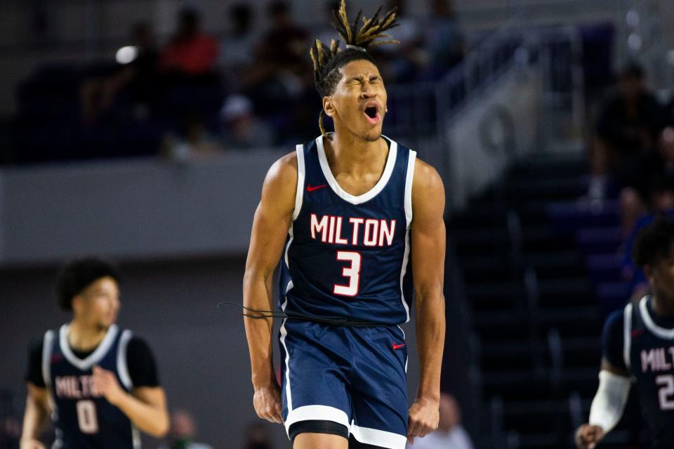 Milton HS' Kanaan Carlyle (3) celebrates after a play during the 48th annual City of Palms Classic between IMG Academy and Milton HS on Wednesday, Dec. 22, 2021 at the Suncoast Credit Union Arena in Fort Myers, Fla. 
