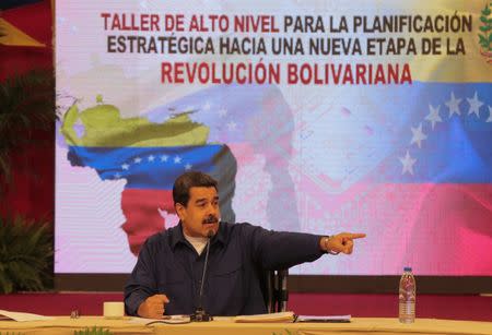 Venezuela's President Nicolas Maduro speaks during a meeting with governors and members of the government in Caracas, Venezuela October 23, 2017. The text reads, "High level workshop for strategic planning towards a new stage of the Bolivarian revolution". Miraflores Palace/Handout via REUTERS