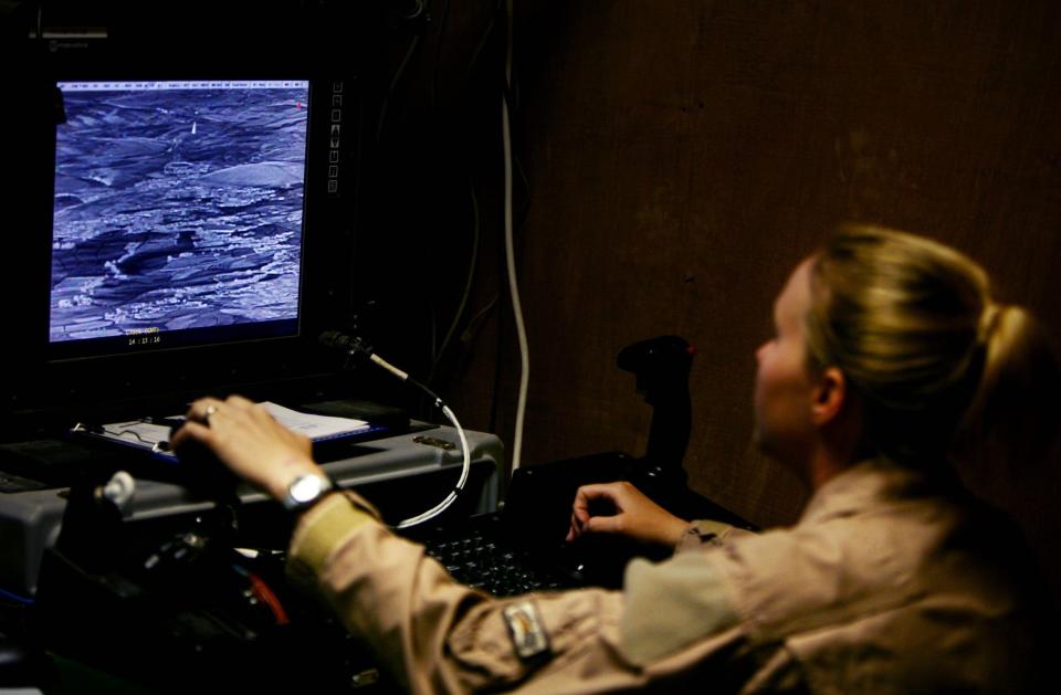 A member of US military watches footage from a Predator drone on a screen in Afghanistan in 2006.
