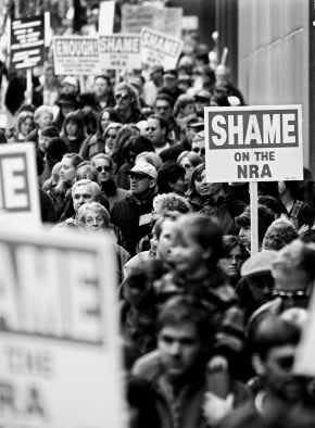 More than 8,000 protesters march toward the National Rifle Association convention in Denver held only a few weeks after the massacre at nearby Columbine High School in 1999.