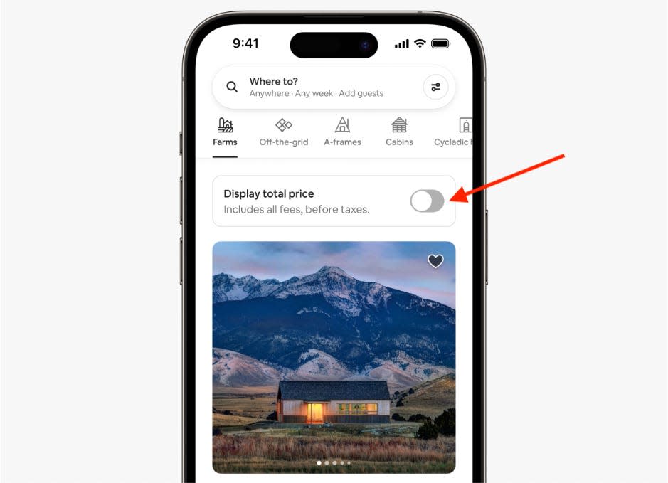 screenshot of a phone screen with a red arrow pointing to what AirBnb's new total price toggle looks like on top of a mountain house listing