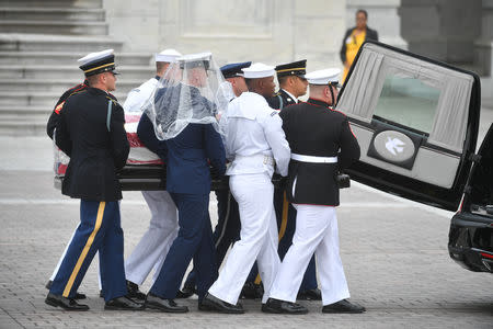 The casket of Senator John McCain, R-Ariz., is carried down the steps of the U.S. Capitol in Washington, U.S. September 1, 2018. Marvin Joseph/Pool via REUTERS