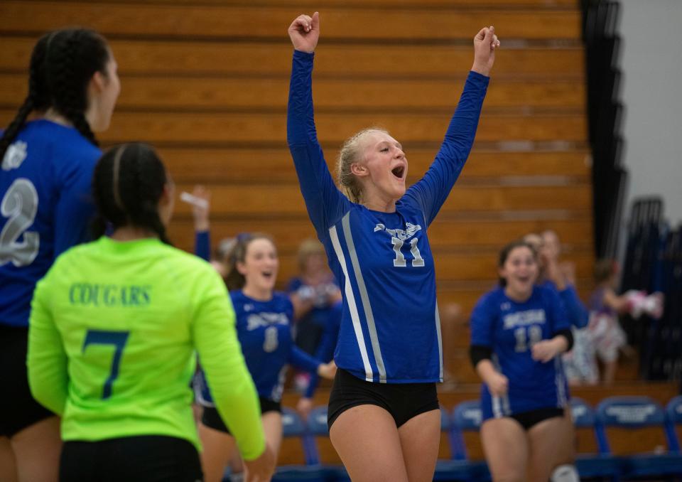 Kendra Pruitt of Barron Collier celebrates with her teammates after winning the second set against Wesley Chapel in the 5A state volleyball semifinals on Saturday, Nov. 5, 2022, at Barron Collier High School in Naples.