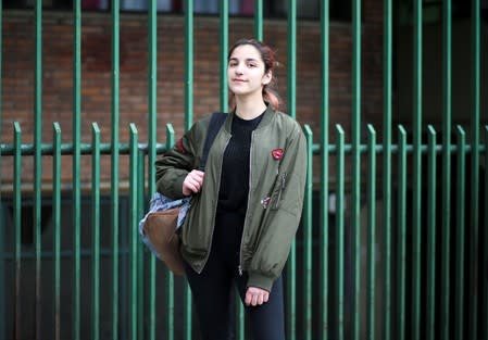 Malena, 16, who voted for the first time in the primary elections, poses in Buenos Aires