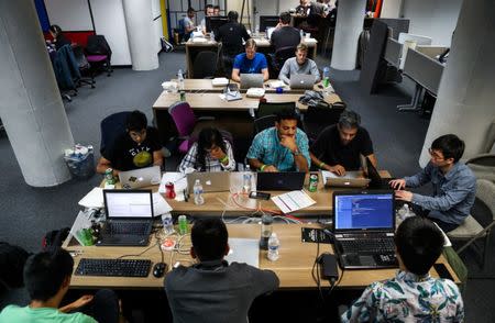 People work on their computers during a weekend Hackathon event in San Francisco, California, U.S. July 16, 2016. REUTERS/Gabrielle Lurie