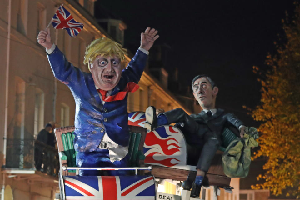 An effigy of Prime Minister Boris Johnson and Leader of the House of Commons Jacob Rees-Mogg during the parade through the town of Lewes (PA)