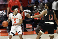 Illinois guard Andre Curbelo (5) is defended by Nebraska forwards Lat Mayen and Derrick Walker (13) during the first half of an NCAA college basketball game Thursday, Feb. 25, 2021, in Champaign, Ill. (AP Photo/Holly Hart)