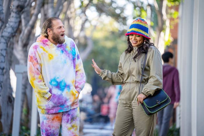 Jonah and Lauren's characters walk down a street together