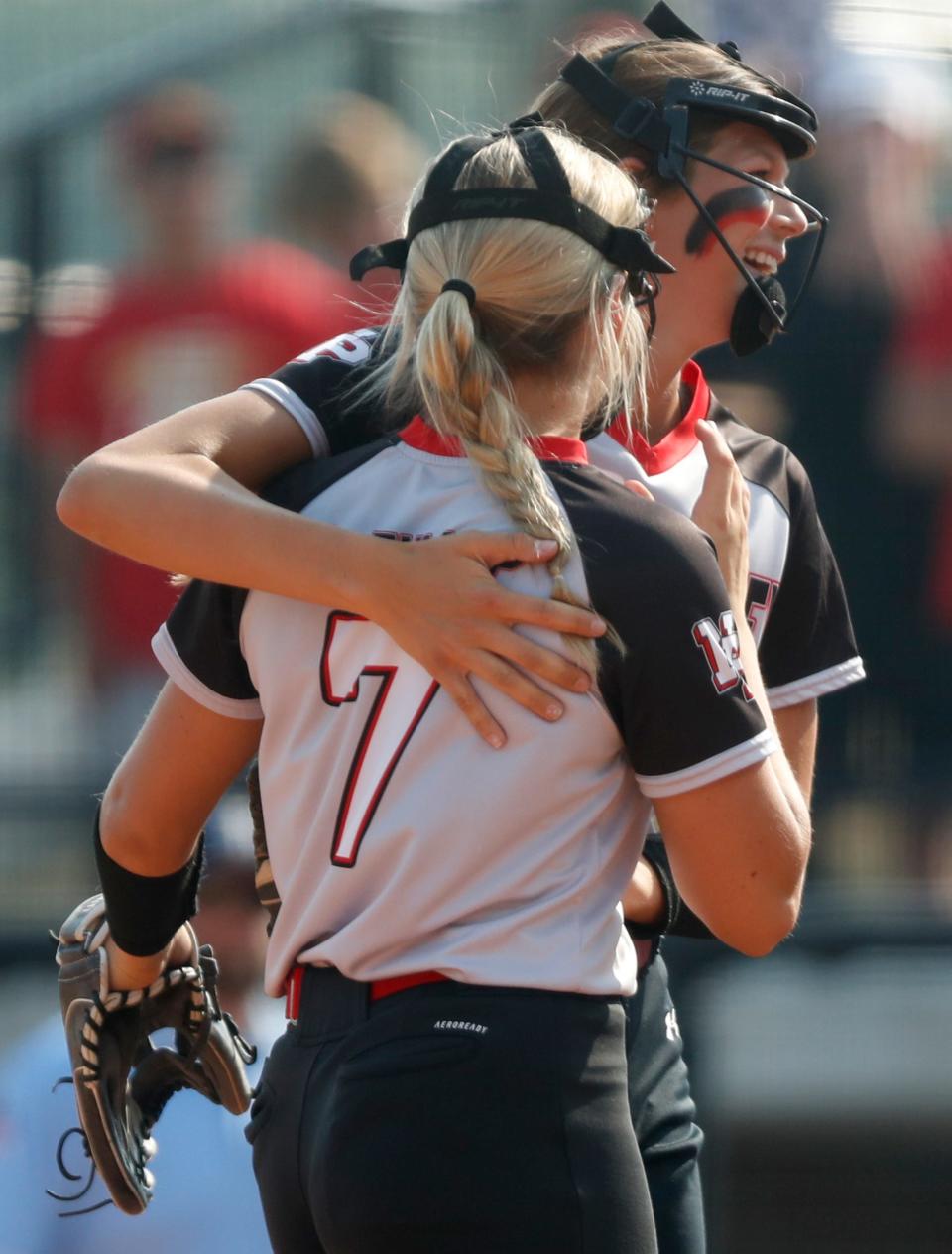 North Posey Vikings Addison Fullop (7) and North Posey Vikings Alyssa Heath (12) hug during the IHSAA Class 2A Softball State Final against the Andrean Fighting 59ers, Friday, June 9, 2023, at Purdue University’s Bittinger Stadium in West Lafayette, Ind. North Posey won 3-0.