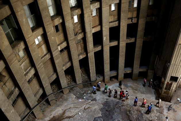 A group of tourists visits the 54-story Ponte Tower building in Johannesburg in January 2015. The distinctive circular tower was once a symbol of this city's modernism, then its decay and now its struggle for regeneration. AP