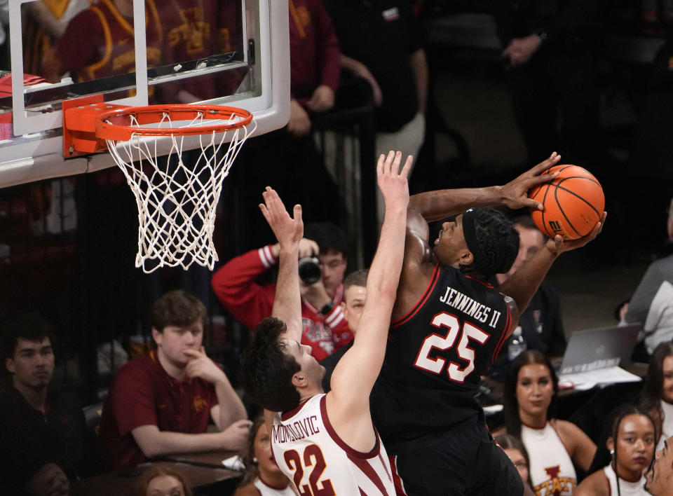 Texas Tech forward Robert Jennings (25) shoots over Iowa State's Milan Momcilovic during the second half of an NCAA college basketball game, Saturday, Feb. 17, 2024, in Ames, Iowa. (AP Photo/Bryon Houlgrave)