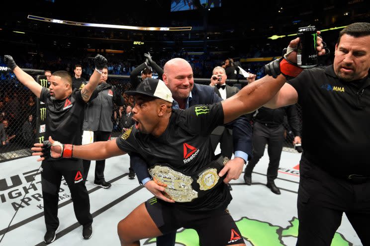 Daniel Cormier shouts at someone near the Octagon after defeating Anthony Johnson. (Getty Images)