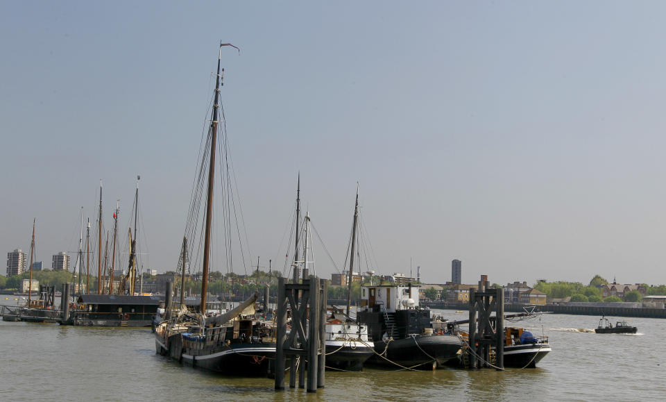 A view of boats on the River Thames from a cycle path in London, Thursday, May 24, 2012. There are many cycle paths across London that can be used to travel the capital. Like a runner or a swimmer, you would need to be physically fit. Like a goalie or a boxer, you should be prepared for close calls. But if you are coming to London's Summer Olympics _ and you have what it takes _ using a bicycle could be a great option in a city bracing for gridlock. (AP Photo/Kirsty Wigglesworth)