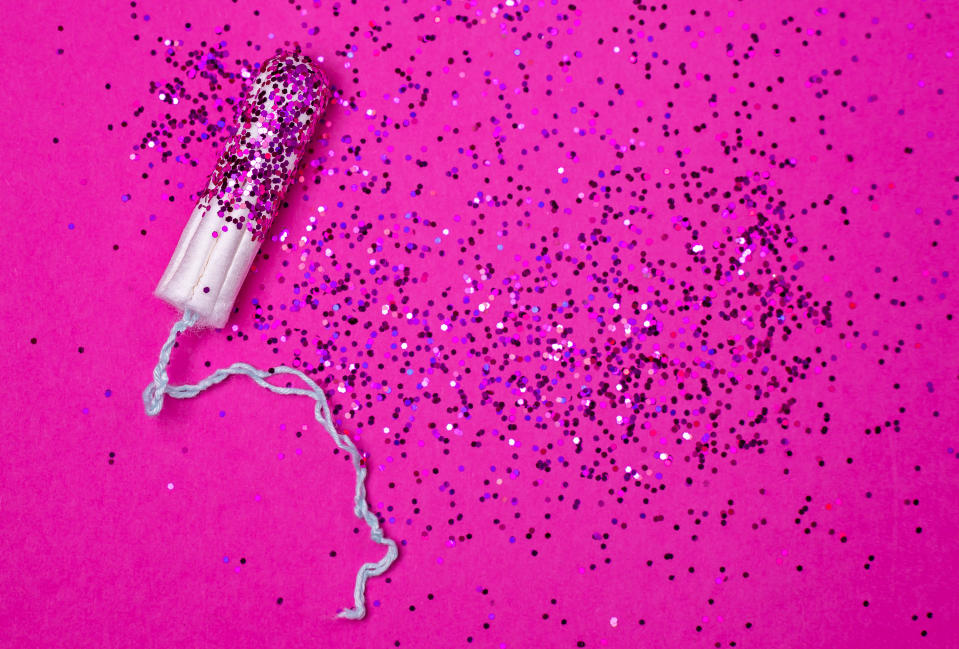 hygienic tampon with pink glitters instead of blood