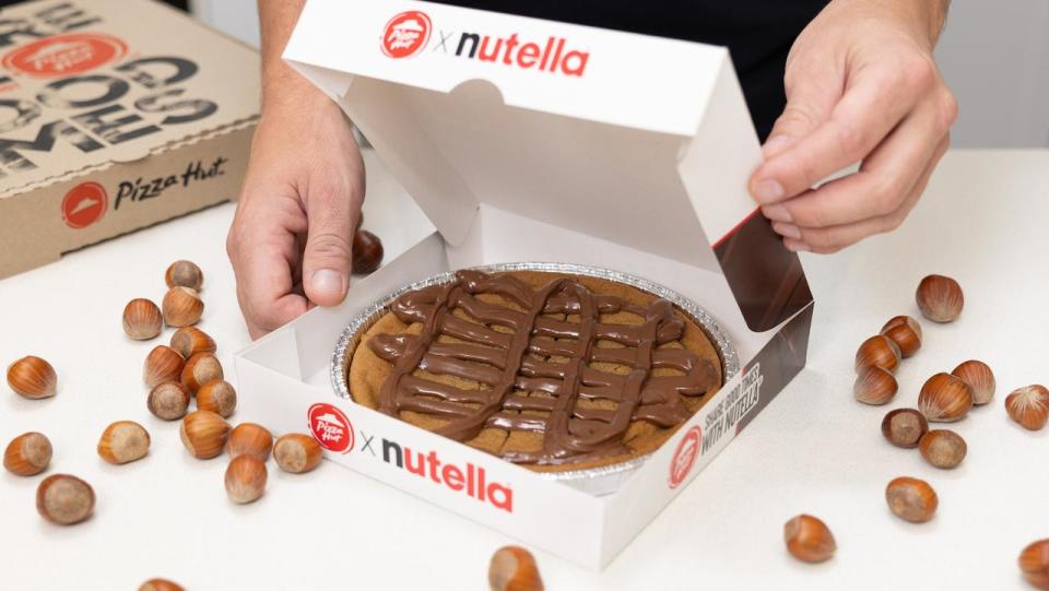 A decadent chocolate dessert is hitting the menus at a popular fast food chain. In a partnership between globally loved brands Pizza Hut and Nutella, a lush new menu item marrying the two companies together will be available from February 22: the loaded cookie with Nutella. Picture: Supplied