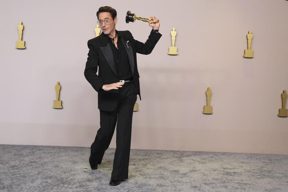 Robert Downey Jr. poses in the press room with the award for best performance by an actor in a supporting role for "Oppenheimer" at the Oscars on Sunday, March 10, 2024, at the Dolby Theatre in Los Angeles. (Photo by Jordan Strauss/Invision/AP)